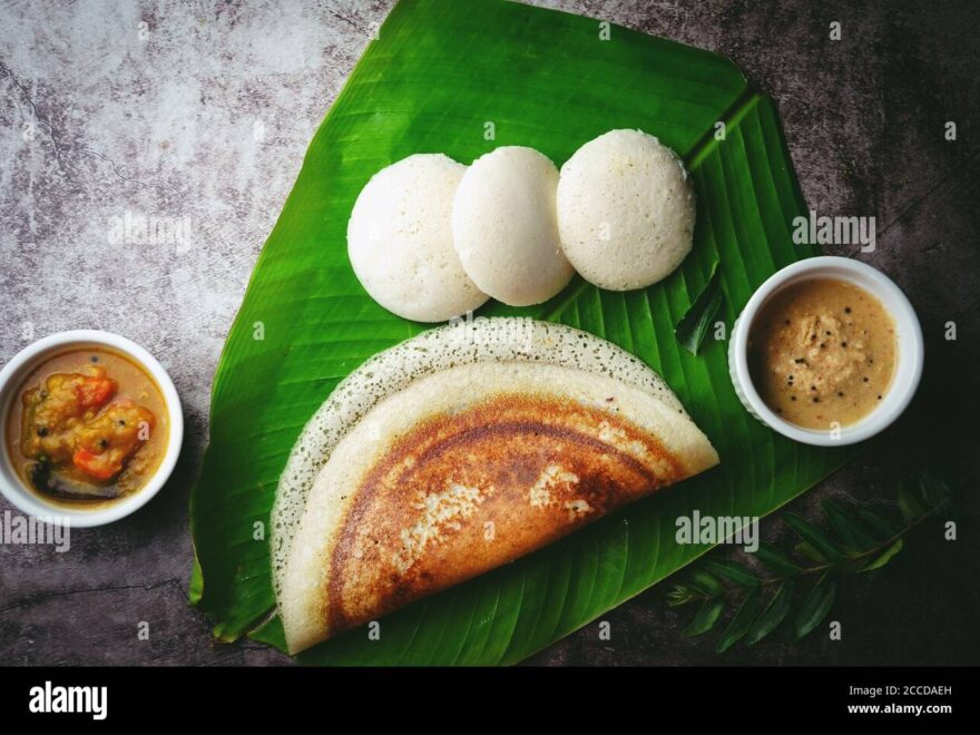 South Indian Breakfast Idli Dosa Sambar And Chutney Served In Banana Leaf Stock Photo Alamy