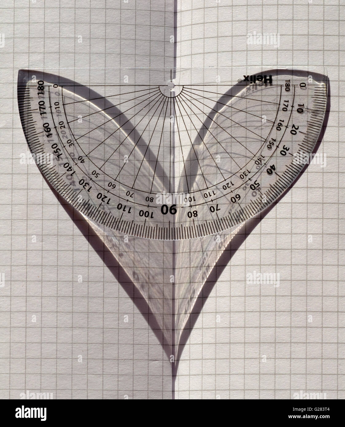 Love Maths A Protractor In Sunlight On Folded Graph Paper The Shadow Depicting A Heart Stock Photo Alamy